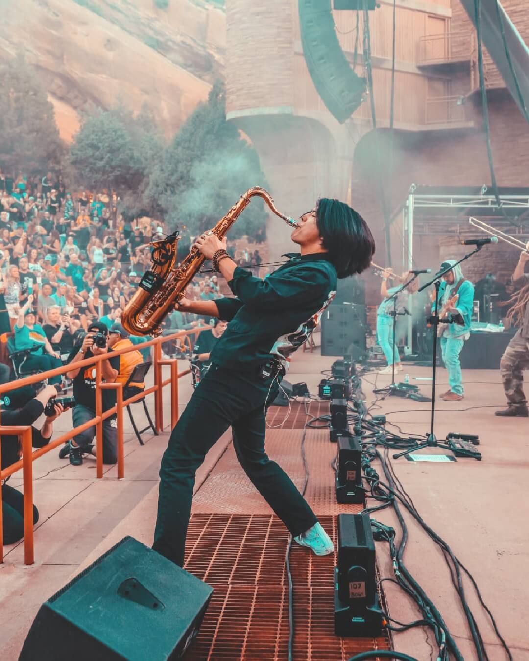musician plays sax on stage