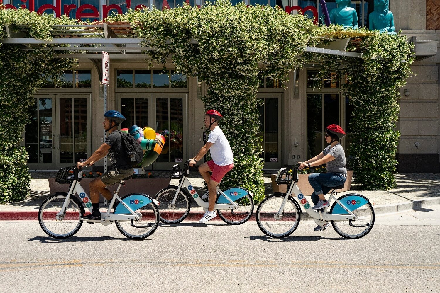 group of bike riders pedal down las vegas street